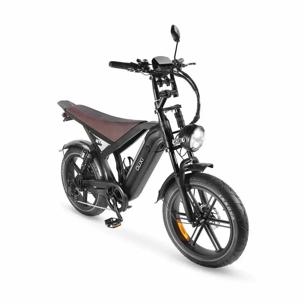 Ouxi GT20 fatbike in black, angled front view with lit round headlight and display on the handlebar